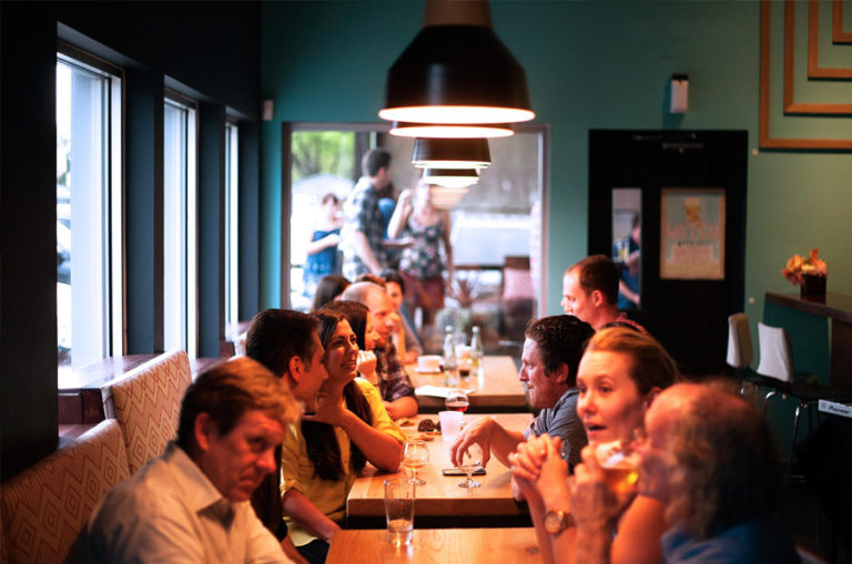 a party of people sitting at a restaurant